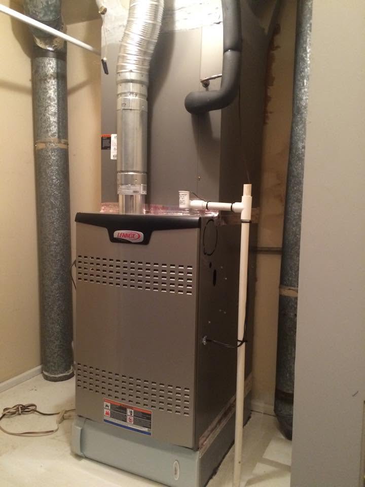 Lennox furnace installed in a residential utility room by Jessie's Air Service in Stephenville TX